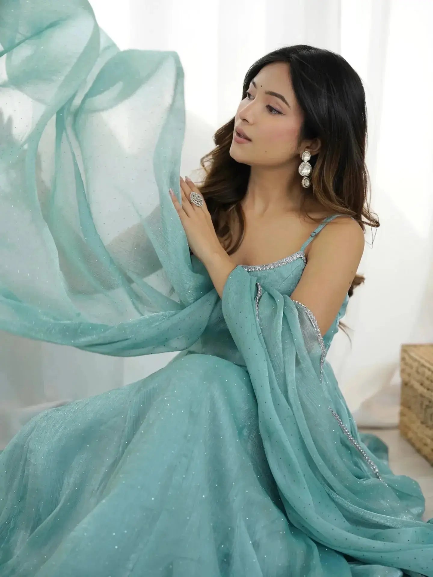 Sky blue Swarovski suit dupatta flowing in twirl pose