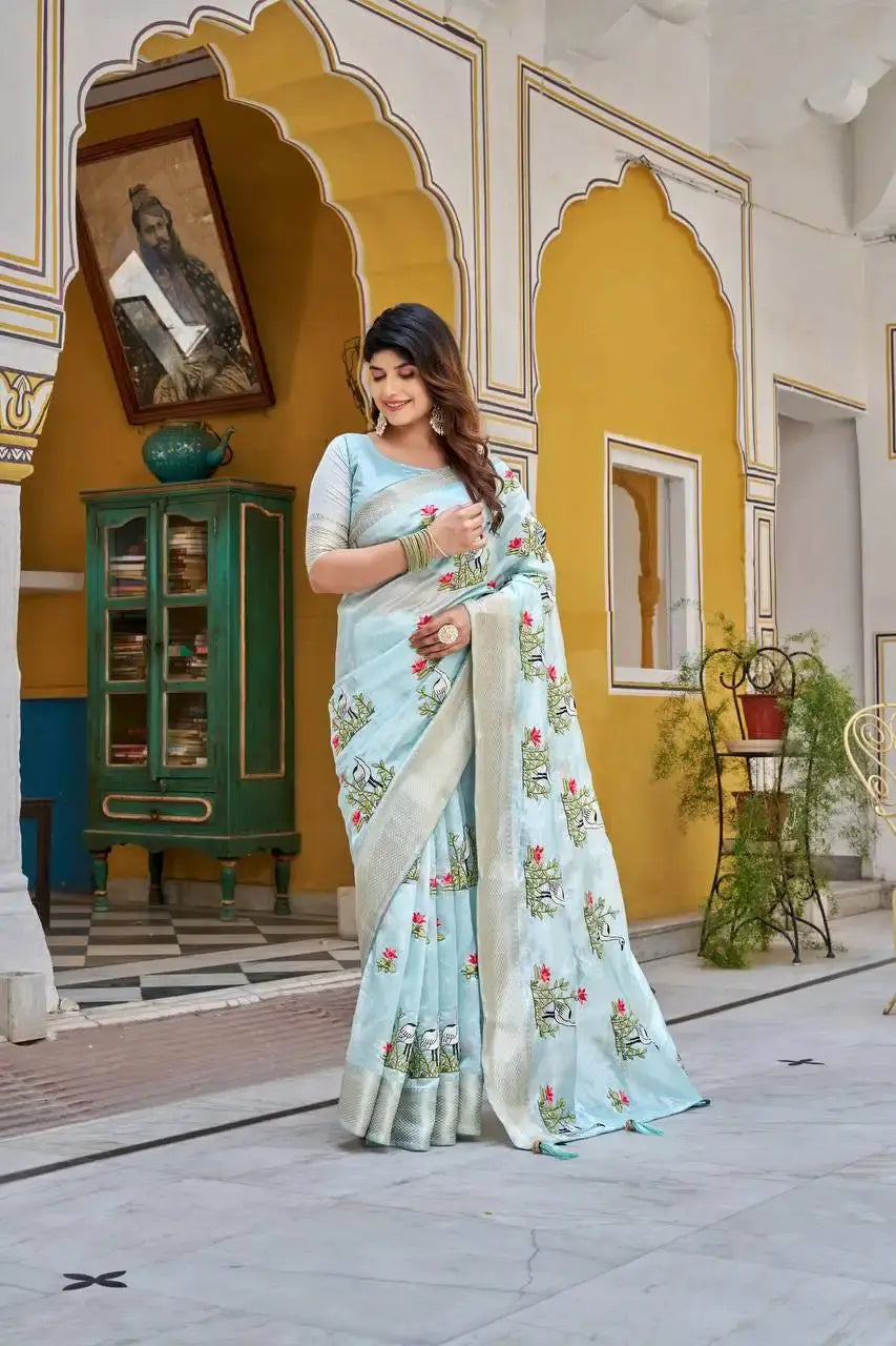 Flat lay view of Sky Blue Thread Embroidered Jacquard Saree with blouse piece