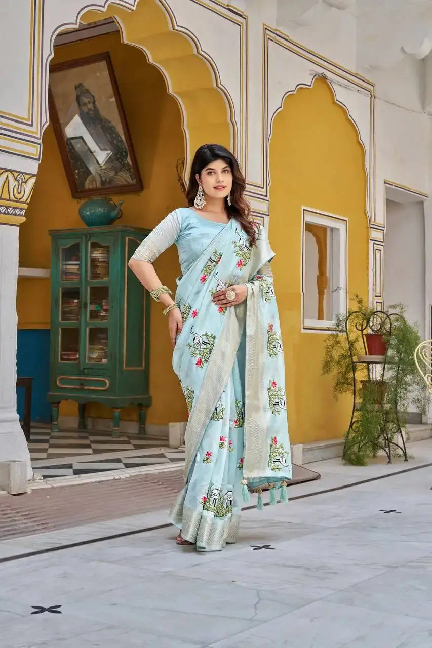 Sky Blue Thread Embroidered Jacquard Saree styled with jewelry, looking down pose