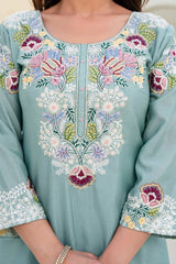 Light blue embroidered dress with floral patterns