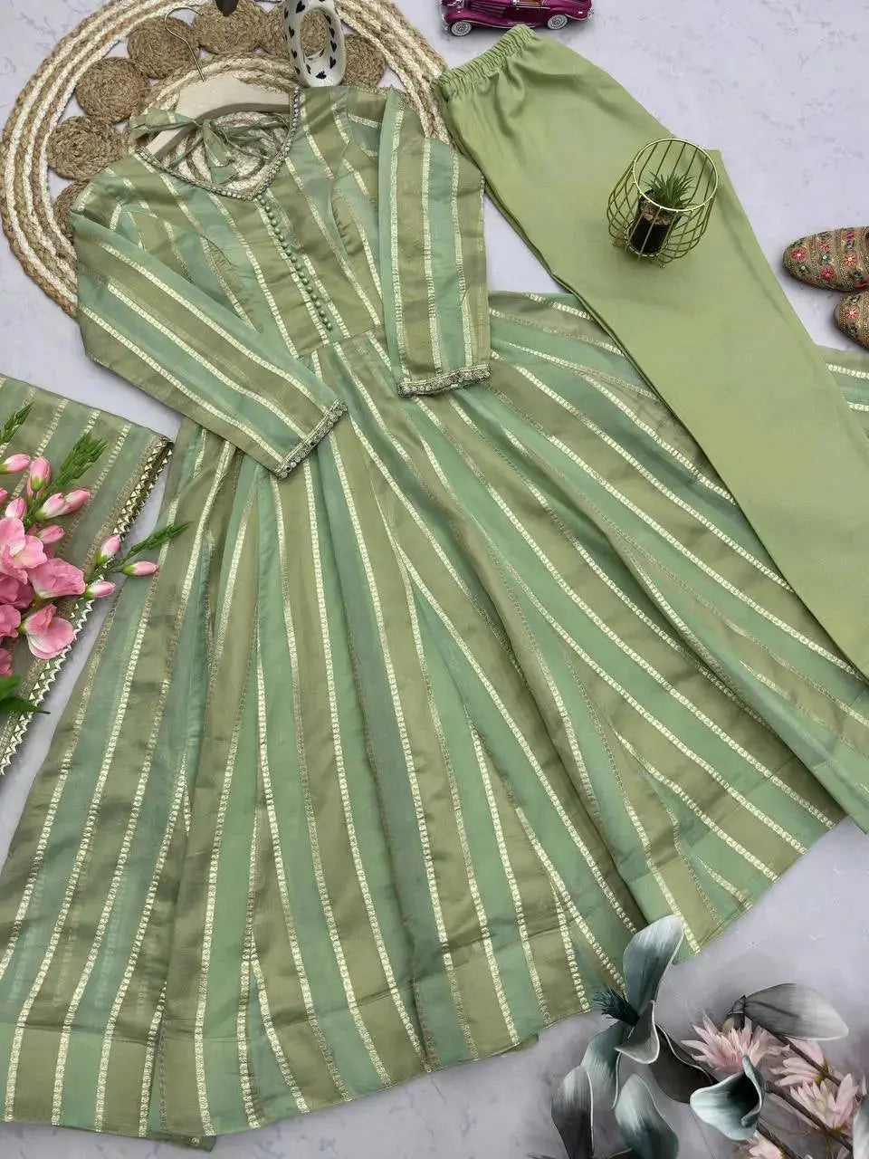Close-up of mirror work embellished neckline on pastel green jacquard suit