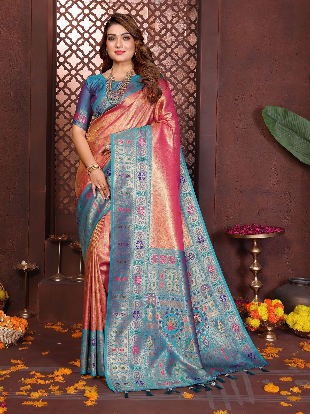 Woman wearing a traditional saree with a decorative background