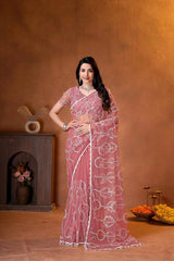 Elegant dusty pink saree adorned with shimmering sequins embroidery and intricate handcrafted detailing for a luxurious festive look.
