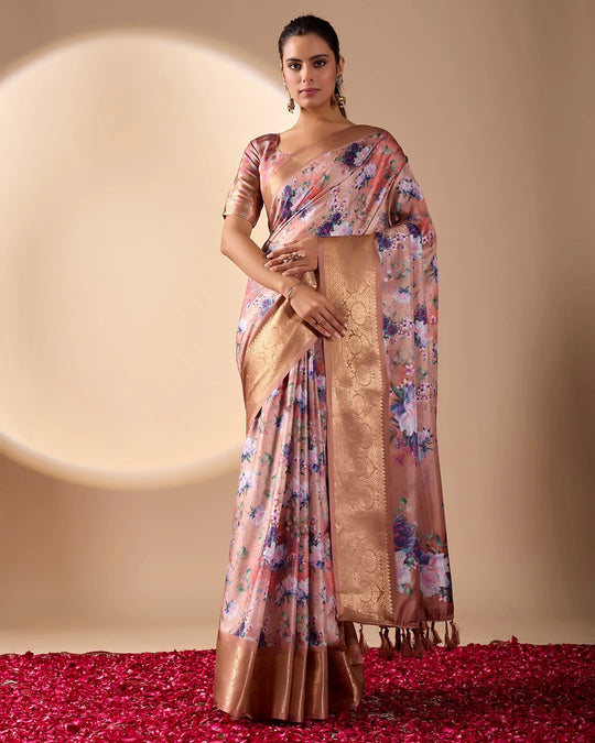 Soft pink lichi silk saree featuring a vibrant floral digital print, an elegant gold zari woven border, and tassel details by Kalyanja.