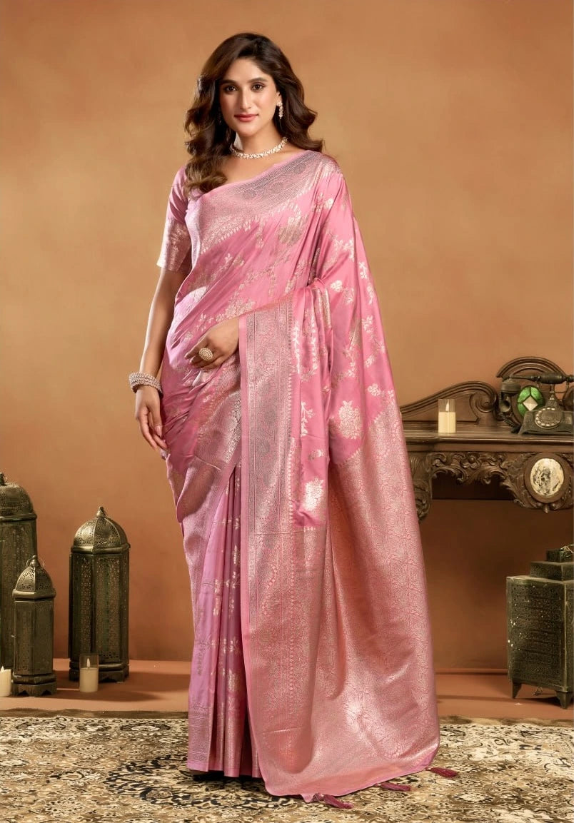 Woman wearing a pink saree with a decorative background