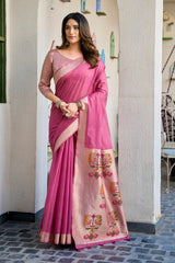 Woman wearing a pink saree with a white background