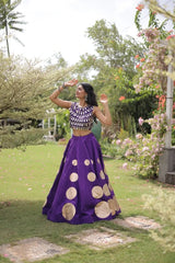 Premium purple party wear lehenga designed with luxurious detailing and elegant traditional craftsmanship.