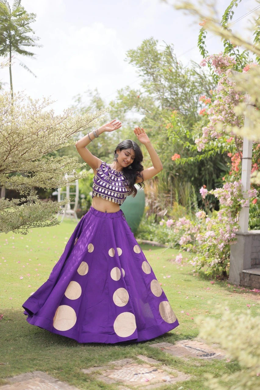 Stylish ethnic outfit combining a contemporary mirror work blouse with a graceful full-flare designer skirt.
