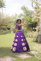 Eye-catching golden circular foil patterns enhance the flowing skirt with a bold and festive appeal.