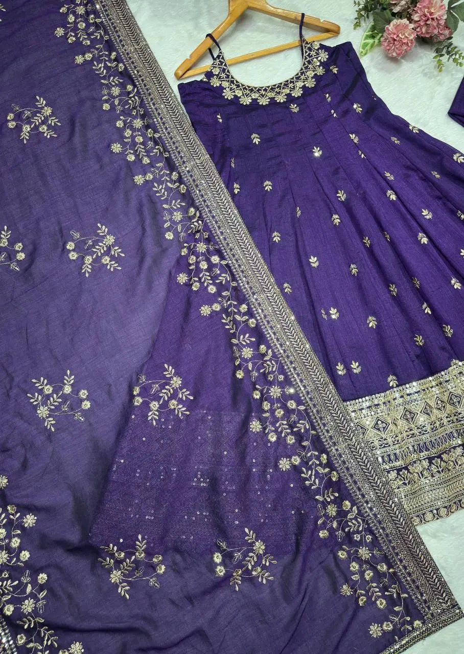 Purple embroidered saree with a matching blouse on a white background