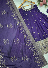 Purple embroidered saree with a matching blouse on a white background