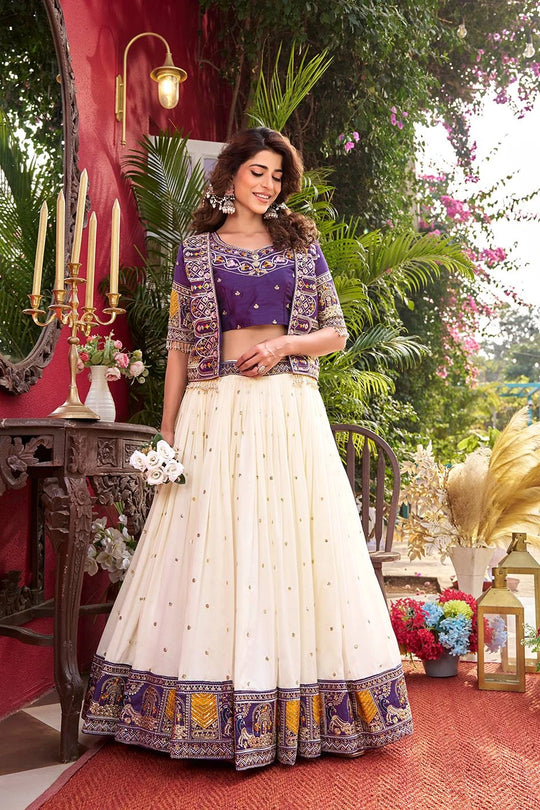 Woman in traditional outfit with floral decorations in an outdoor setting