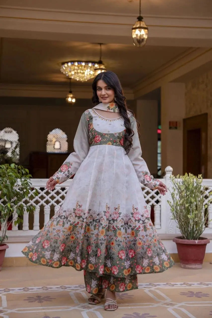 Premium Anarkali dress paired with matching floral palazzo pants and a coordinated printed dupatta with tassel detailing.