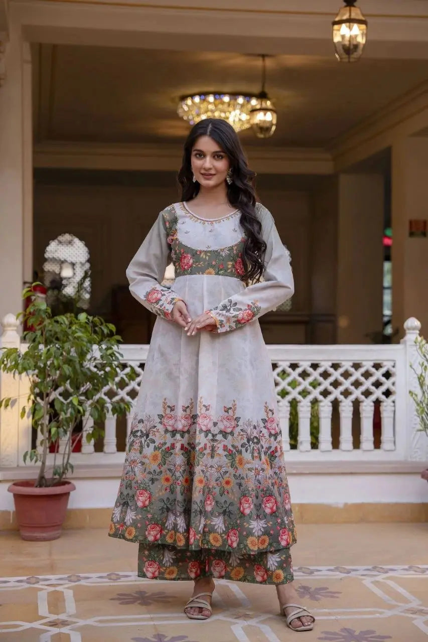 Designer ethnic suit with a graceful floral yoke, full sleeves, and intricate printed borders for a timeless traditional look.