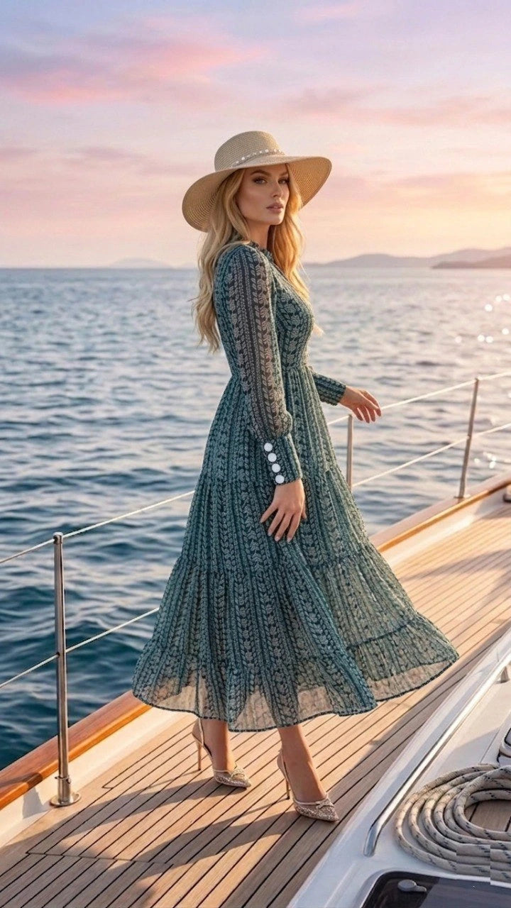 Woman in a green dress and hat on a boat at sunset