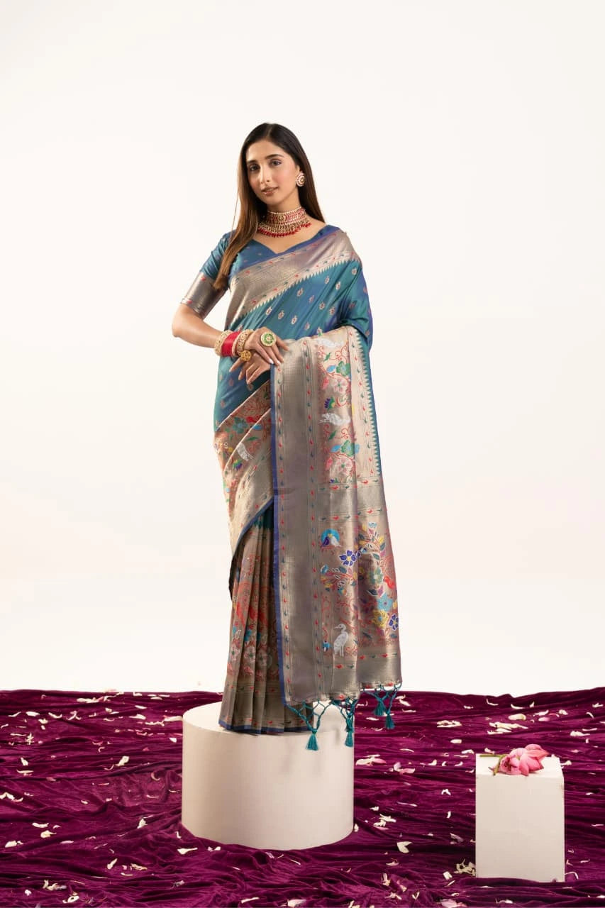 Woman wearing a saree with a floral pattern on a white background