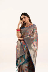 Woman wearing a floral saree with a white background
