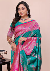 Woman wearing a green and pink saree with a beige background