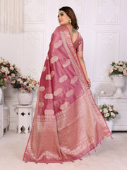 Woman wearing a pink saree with a white background