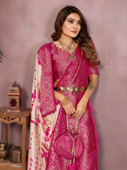 Woman wearing a pink saree with a matching blouse against a purple background