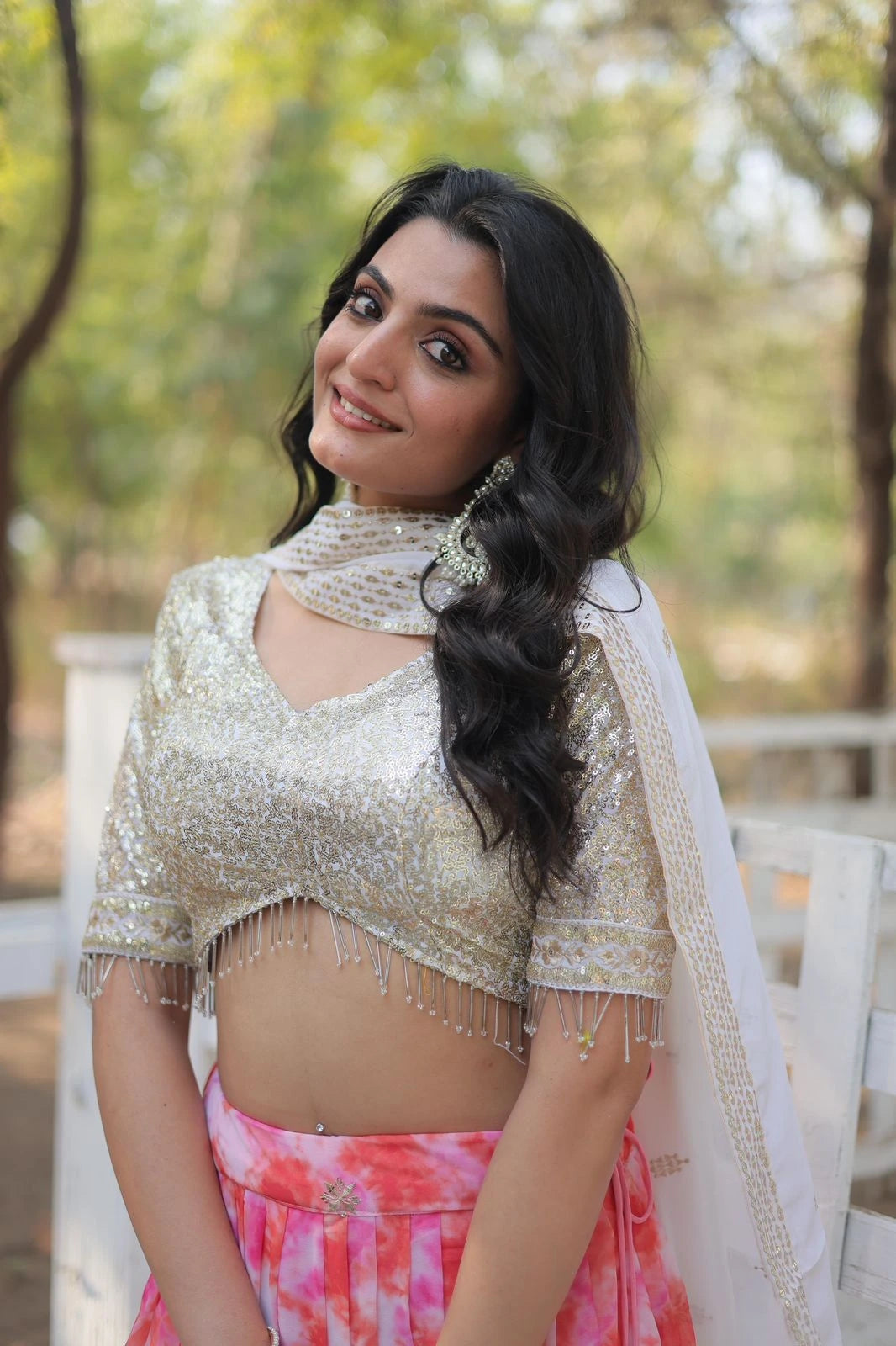 Woman in a traditional outfit with a blurred natural background