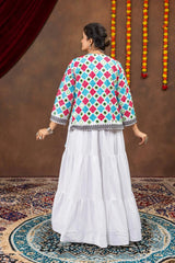 Back view of white tiered lehenga showing layered skirt and back of bandhej mirror-work koti