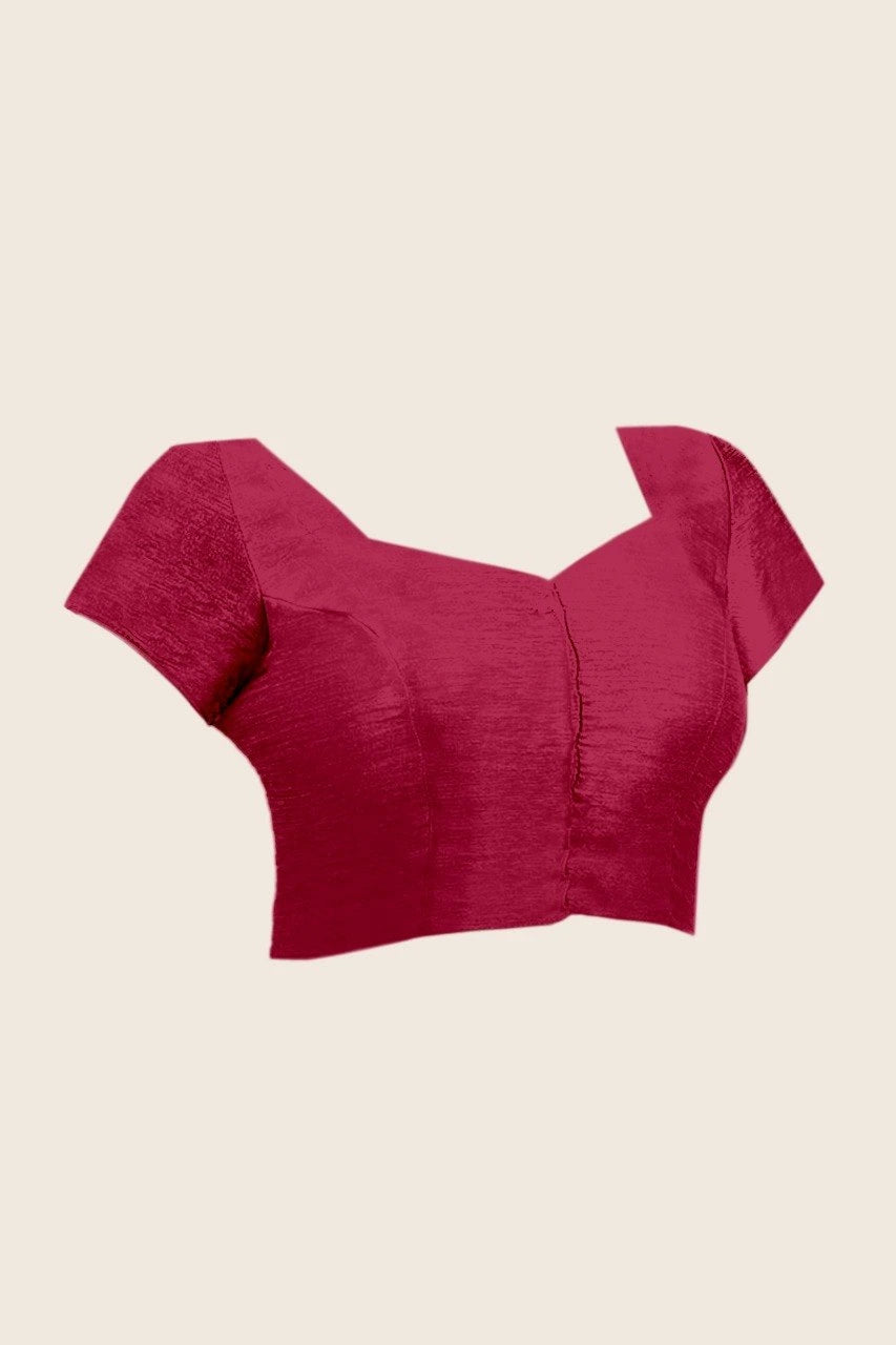 Red crop top with bow details on a beige background