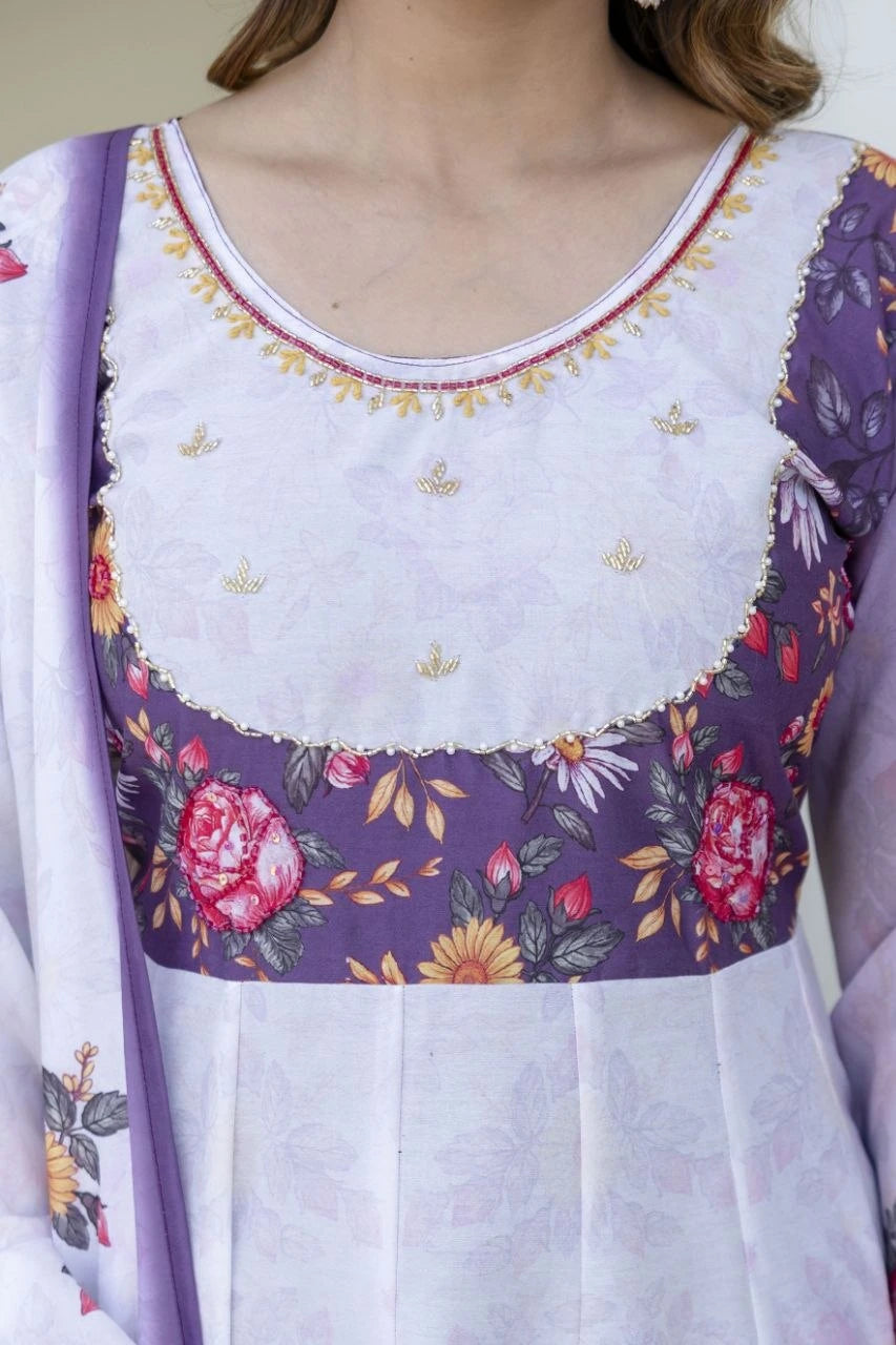 Festive floral Anarkali ensemble in pastel lavender with blooming rose prints, flowy sleeves, and coordinated ethnic styling.
