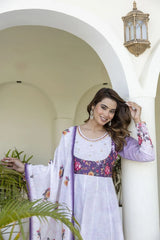 Women's floral ethnic suit featuring an Anarkali kurta, coordinating floral pants, and a delicate printed dupatta for a refined appearance.