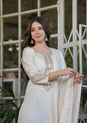 Elegant white Chanderi silk kurti featuring detailed thread embroidery and shimmering zari accents.
