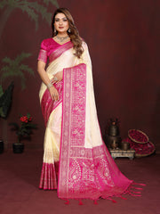 Woman wearing a pink and white saree with a dark background