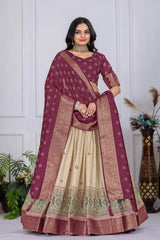 Woman wearing a traditional maroon and beige saree with a white background