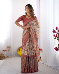 Woman wearing a patterned saree with a white background