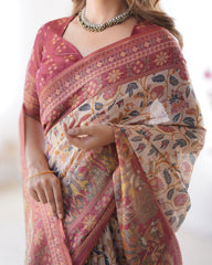 Woman wearing a patterned saree with a white background