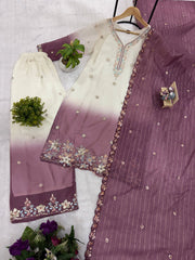 Purple and white embroidered fabric with a hanger on a light gray background