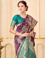 Woman wearing a purple and green saree with a decorative background