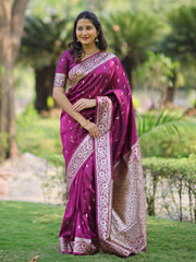 Woman wearing a purple saree with a garden background