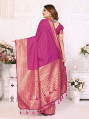 Woman wearing a pink saree with a white background
