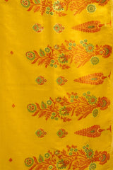 Yellow fabric with red and green floral patterns