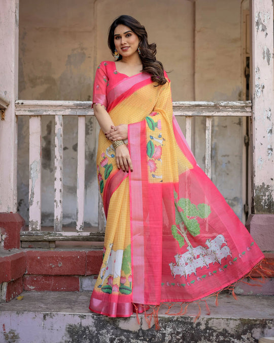 Woman wearing a yellow and pink saree with floral patterns on a rustic background