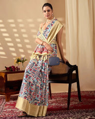 Stylish woman posing in a designer printed saree with a golden zari border, creating a sophisticated festive and ethnic look.