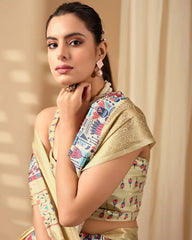 Beautiful ethnic saree with colorful handcrafted-inspired patterns, a luxurious golden border, and a coordinated sleeveless blouse.