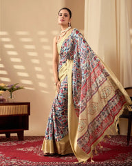 Elegant Indian saree adorned with artistic geometric and floral prints, complemented by a shimmering gold border and pearl necklace.