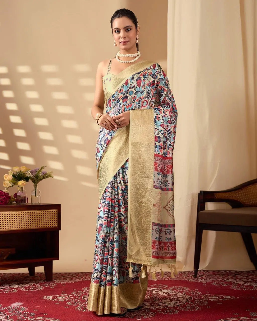 Graceful model showcasing a printed ethnic saree featuring vibrant motifs, a golden pallu, and a matching sleeveless blouse.