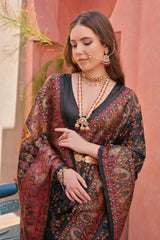 Woman wearing black Kashmiri Jal weaving saree with intricate multicolor patterns and traditional Indian jewelry