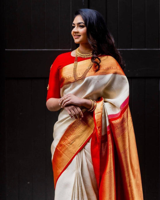 Cream jacquard weaving saree with red zari border draped on model – Kalyanja KS409 front view