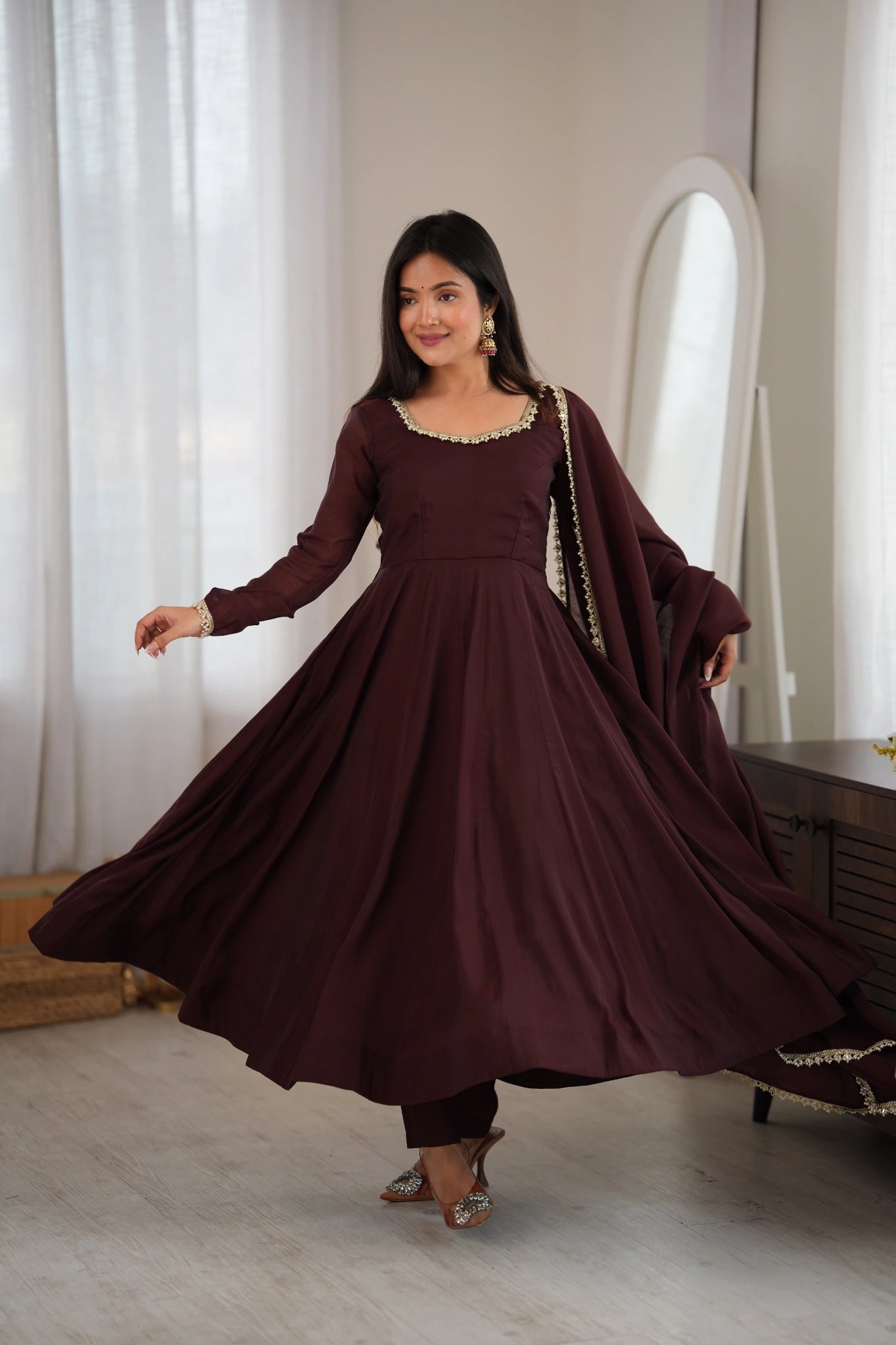 Dark Brown Anarkali suit twirl showing full floor-length flare