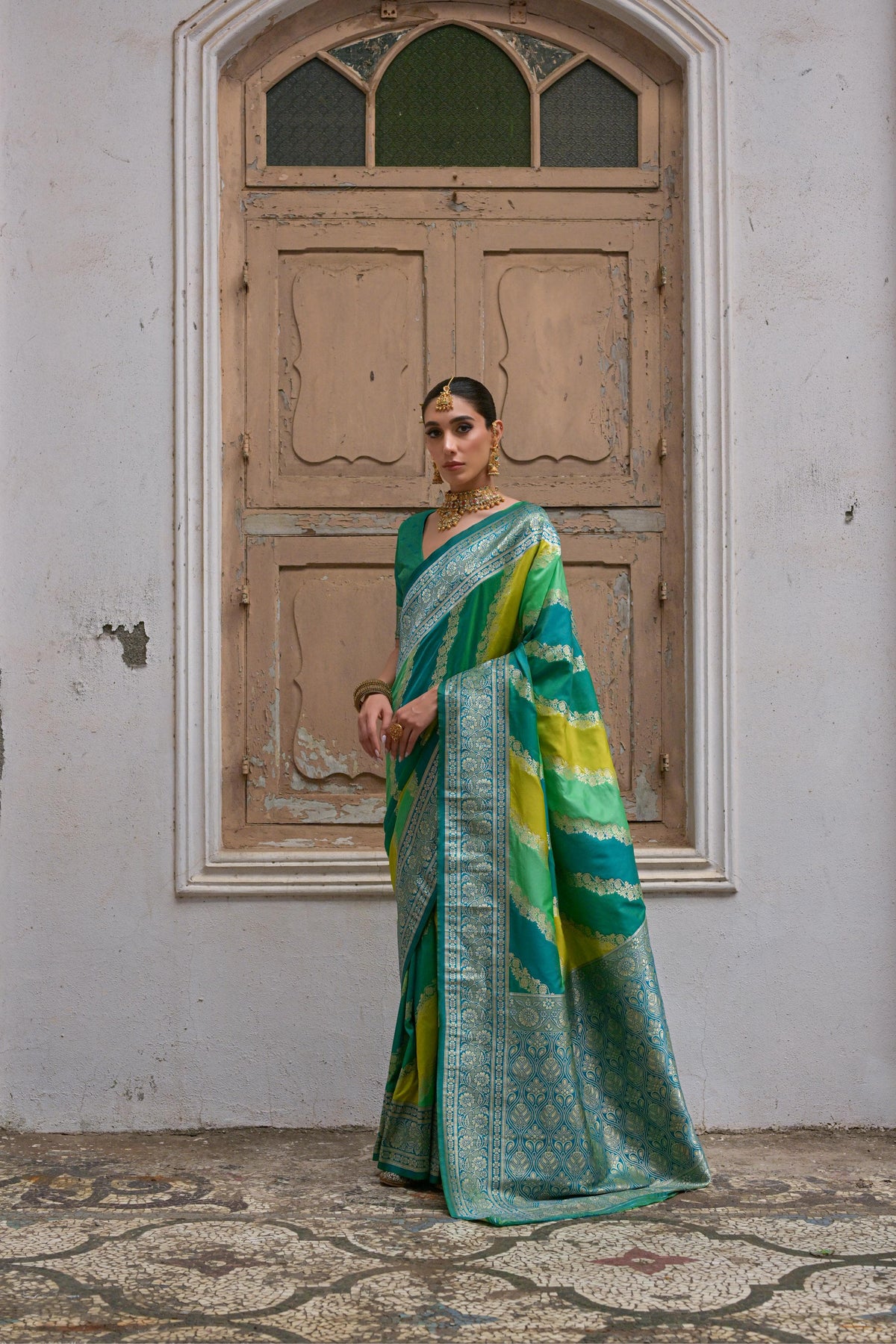 Green saree with Kadwa style weaving and multicolor stripes