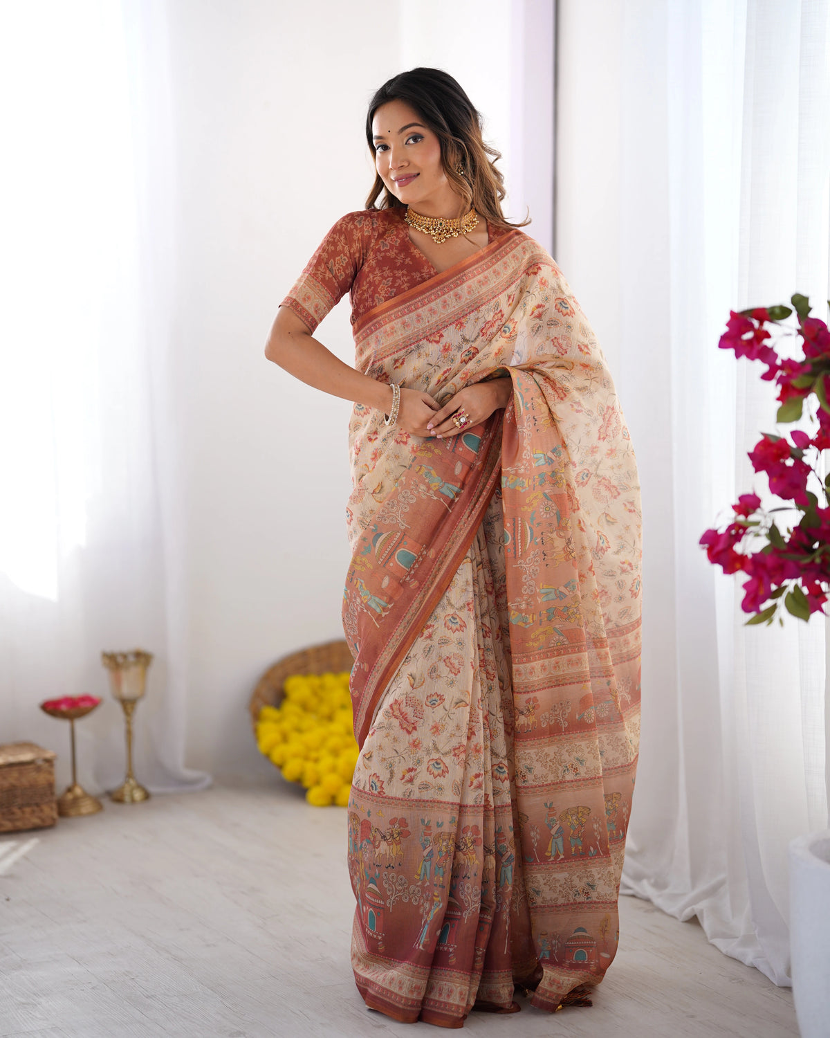 Woman wearing a traditional saree with a floral background