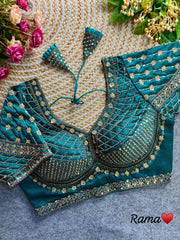 Light sea green blouse with intricate sequence and codding thread work, crafted from soft silk fabric.